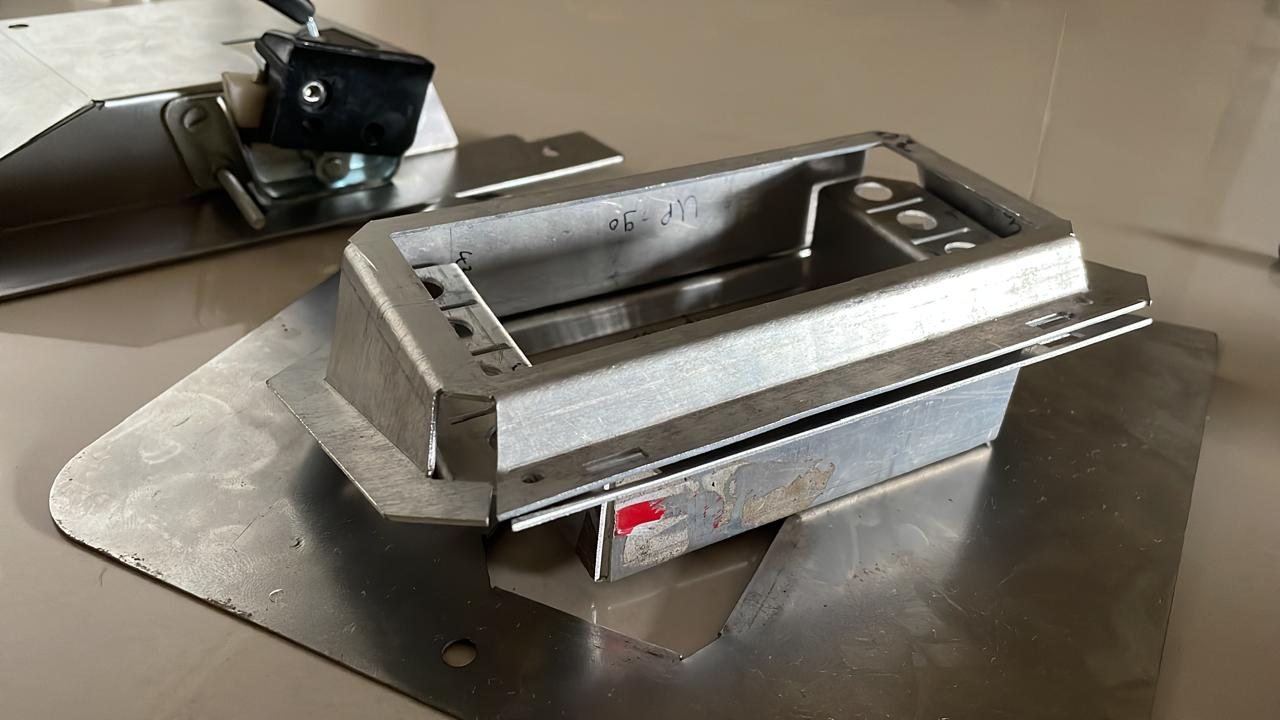 The machined aluminium speedometer casing on the bench