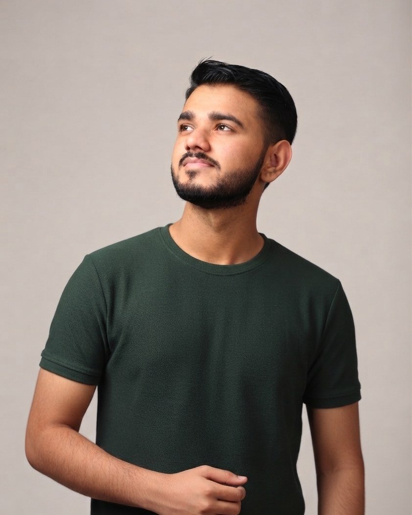 Portrait of Hardik Dhanak in a dark green t-shirt
